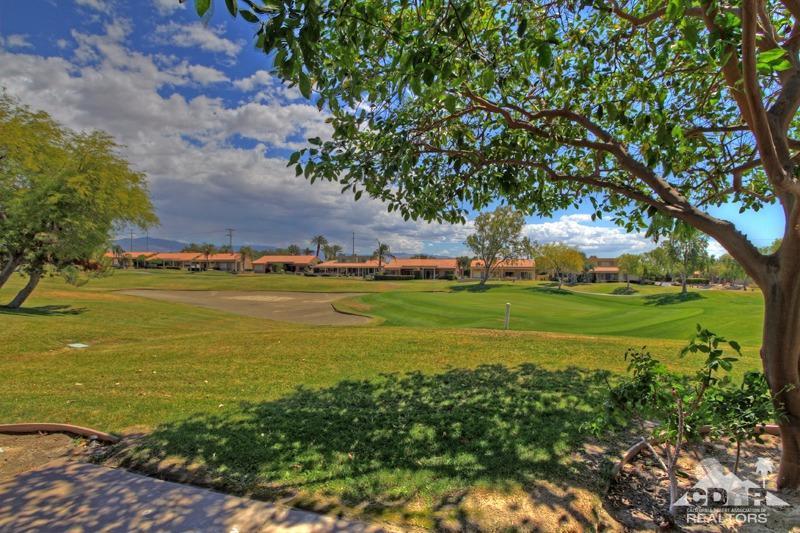 56 Oak Tree Drive Rancho Mirage, CA 92270 - Photo 31 of 32 a view of an ocean with a building in the background