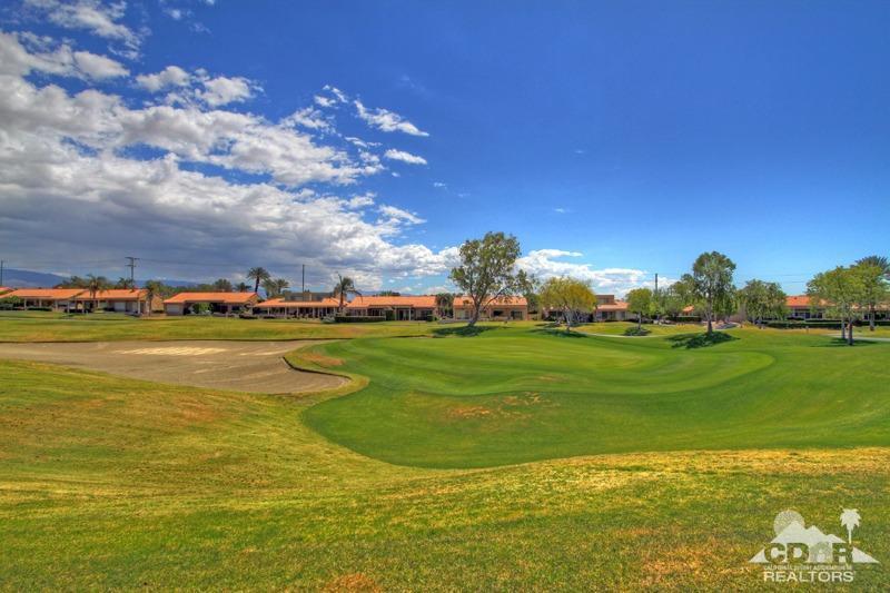56 Oak Tree Drive Rancho Mirage, CA 92270 - Photo 32 of 32 a view of a lake with houses