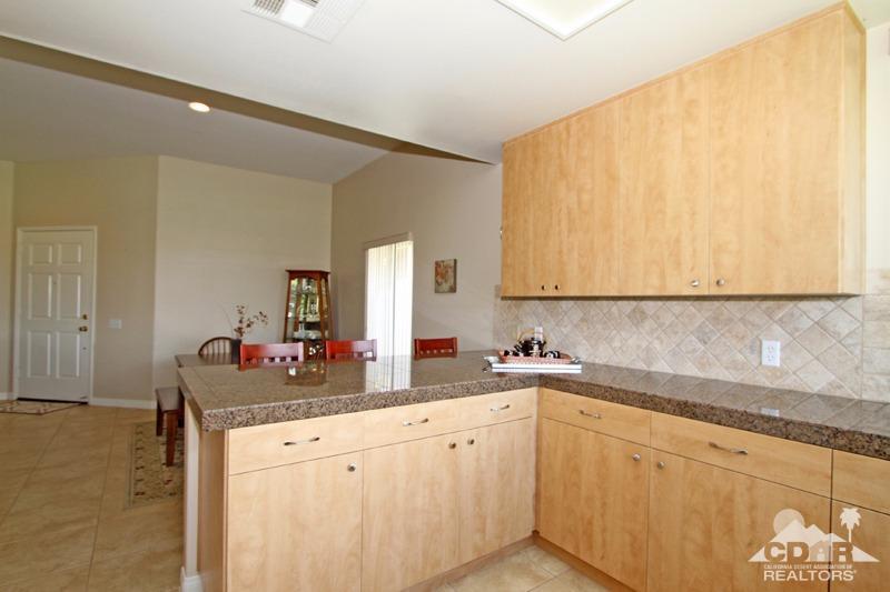 56 Oak Tree Drive Rancho Mirage, CA 92270 - Photo 4 of 32 a white kitchen with sink and cabinets
