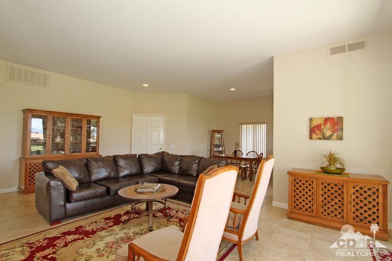 56 Oak Tree Drive Rancho Mirage, CA 92270 - Photo 8 of 32 a living room with furniture and a window