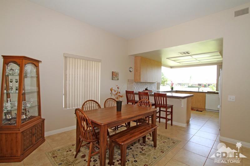 56 Oak Tree Drive Rancho Mirage, CA 92270 - Photo 10 of 32 a view of a dining room with furniture and window