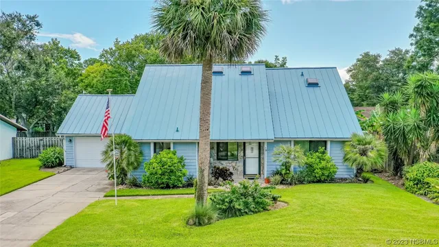 a house view with a garden space