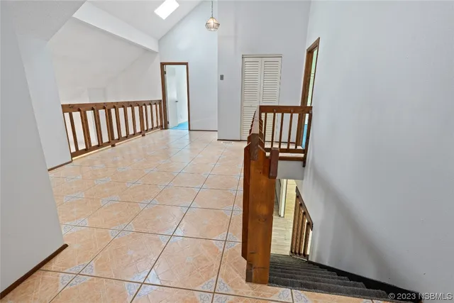 a view of a hallway with staircase