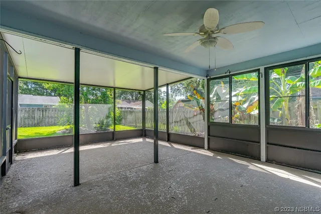 a view of an empty room and window