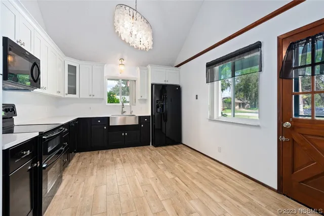 a room with a bed dresser and a window