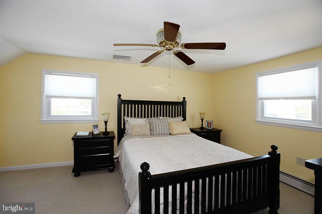 45 Alma Road Long Beach Township, NJ 08006 - Photo 14 of 29 a bedroom with a bed and a window