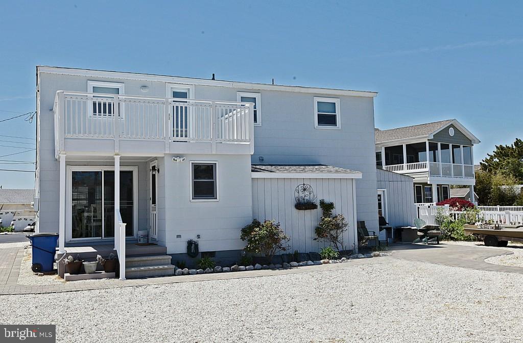 45 Alma Road Long Beach Township, NJ 08006 - Photo 16 of 29 a view of a house with backyard and sitting area