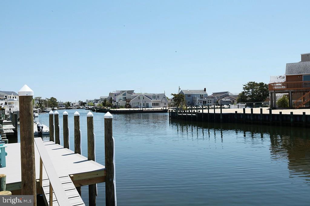 45 Alma Road Long Beach Township, NJ 08006 - Photo 3 of 29 a view of a lake with boats and trees
