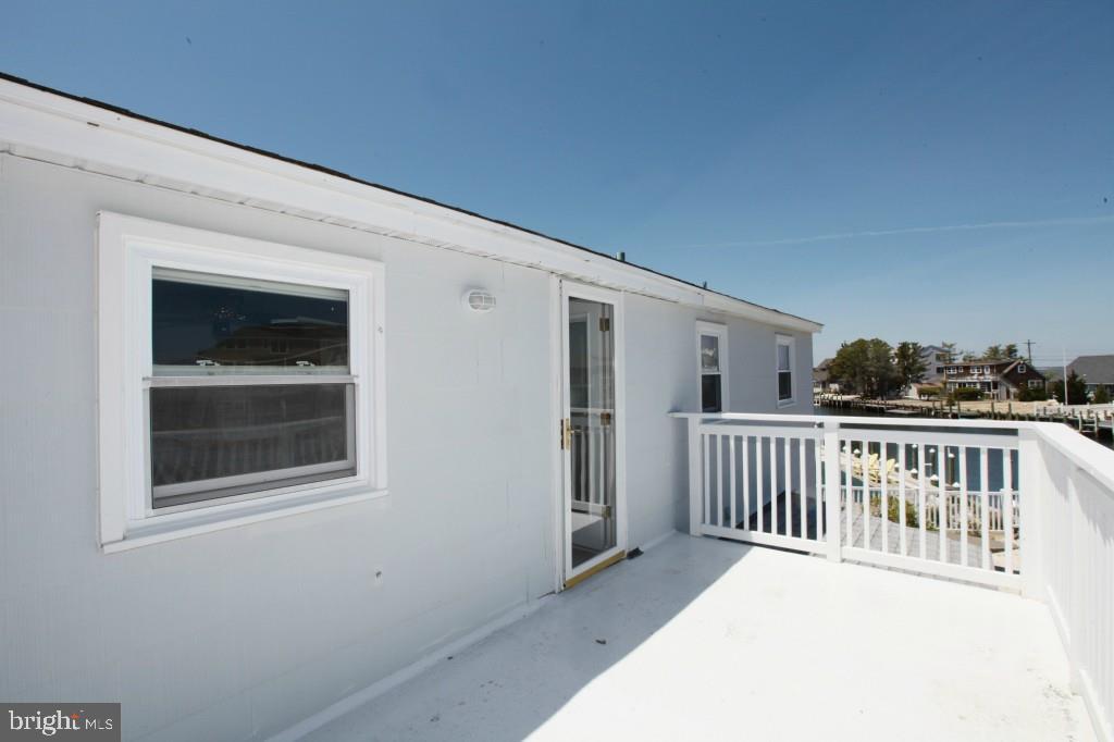 45 Alma Road Long Beach Township, NJ 08006 - Photo 21 of 29 a balcony with window