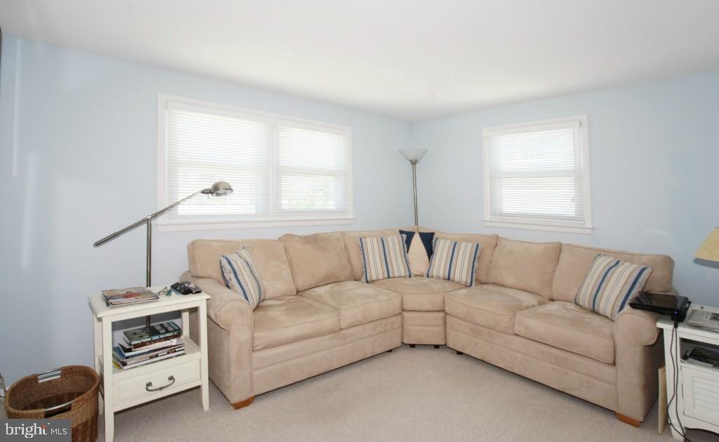 45 Alma Road Long Beach Township, NJ 08006 - Photo 23 of 29 a living room with furniture and a window