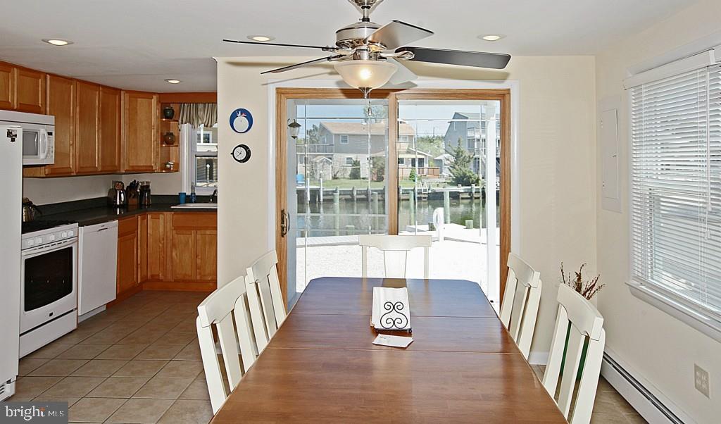 45 Alma Road Long Beach Township, NJ 08006 - Photo 8 of 29 a view of a kitchen with wooden floor and stainless steel appliances