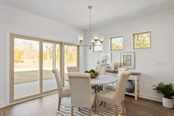 a view of a dining room with furniture window and wooden floor