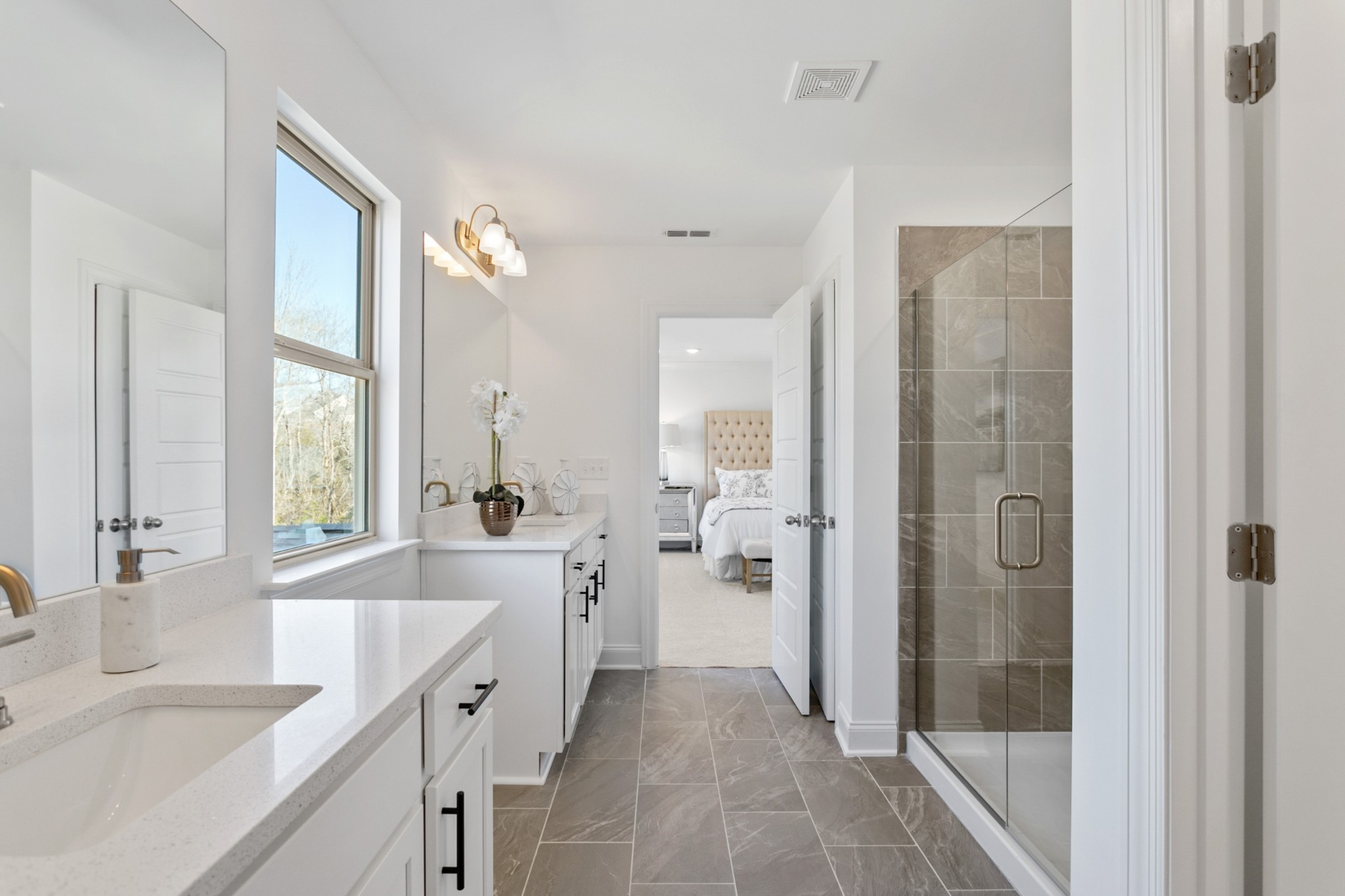 1104 Riverview Run Madison, TN 37115 - Photo 37 of 57 a large white bathroom with a granite countertop shower a sink and a large mirror