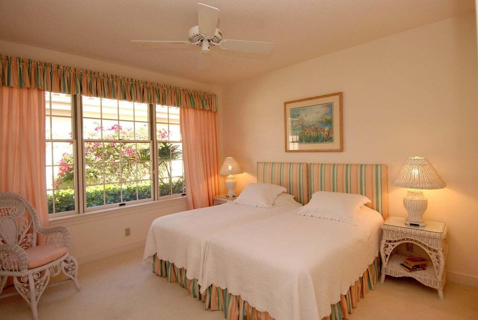 3446 Southern Cay Drive Jupiter, FL 33477 - Photo 11 of 15 a bedroom with a bed and a large window