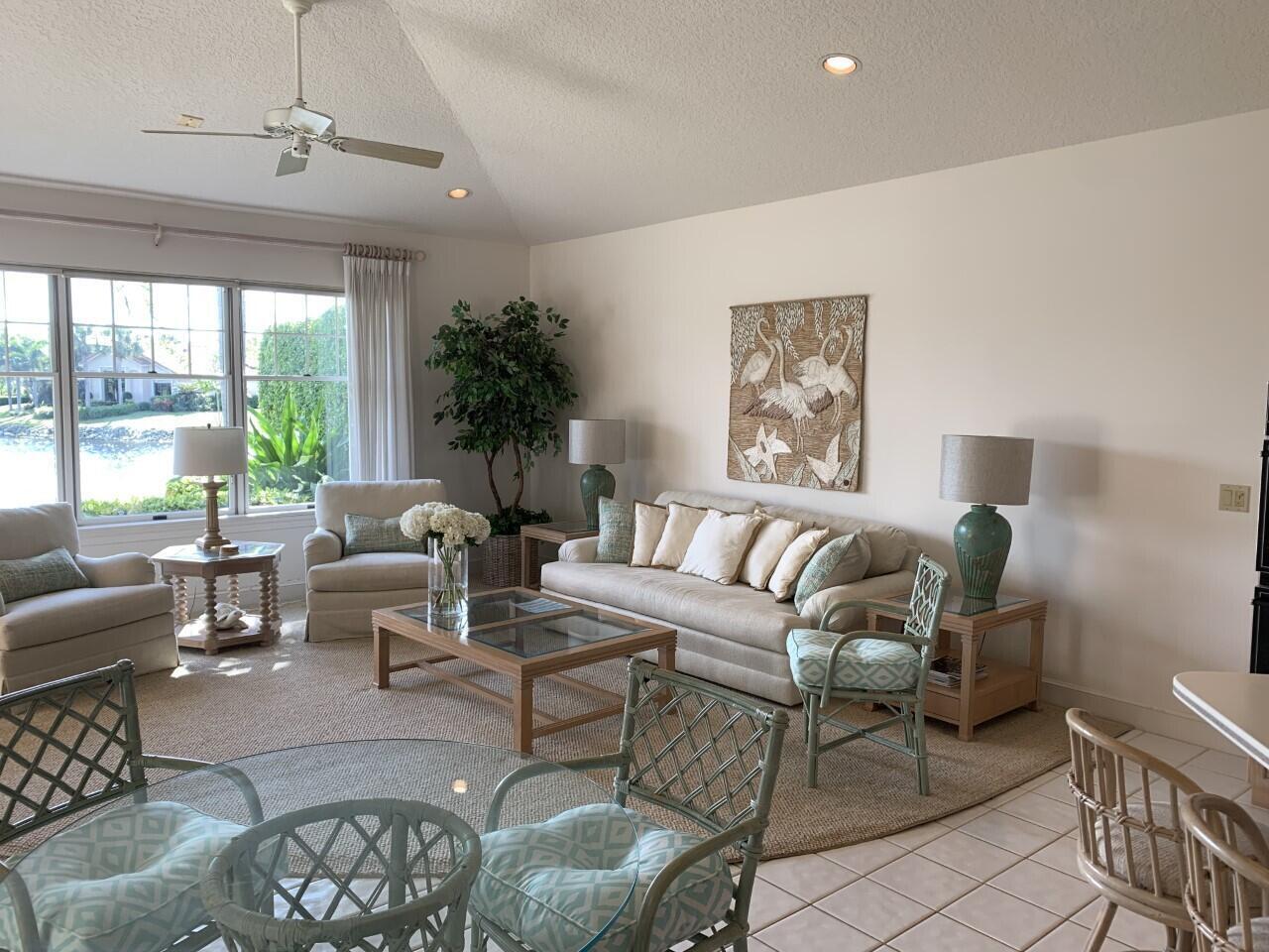 3446 Southern Cay Drive Jupiter, FL 33477 - Photo 3 of 15 a living room with furniture and a large window