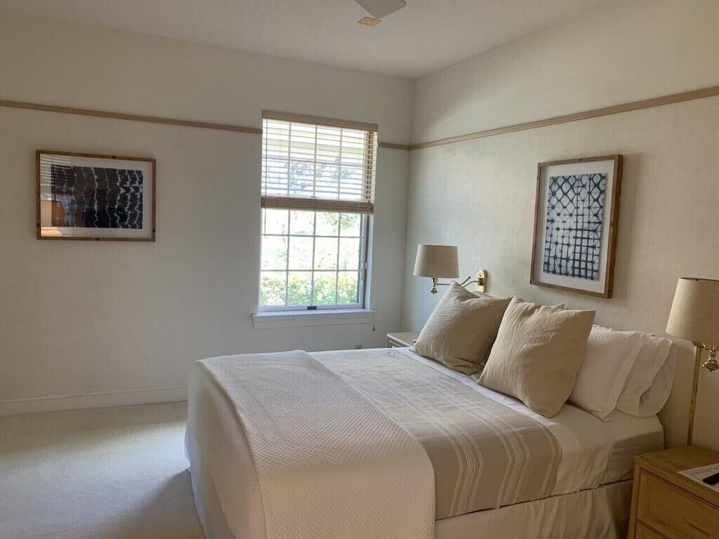 3446 Southern Cay Drive Jupiter, FL 33477 - Photo 10 of 15 a bedroom with a bed and a window