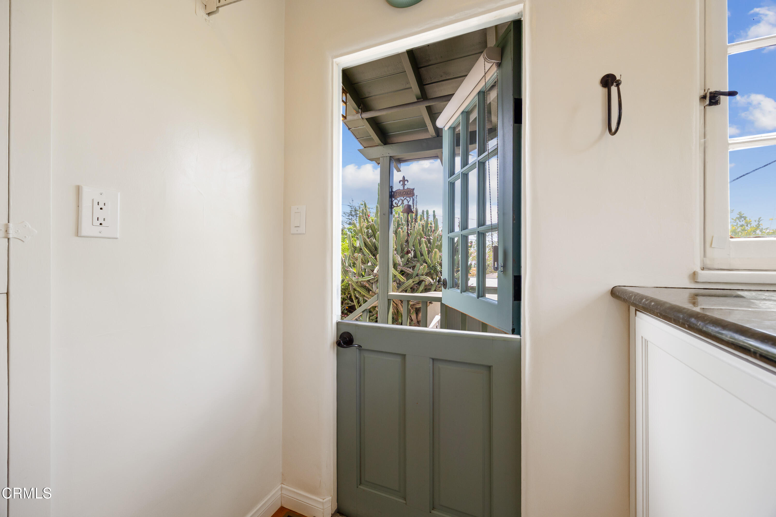 974 Athens Street Altadena, CA 91001 - Photo 13 of 24 a view of a hallway with wooden floor and a bathroom
