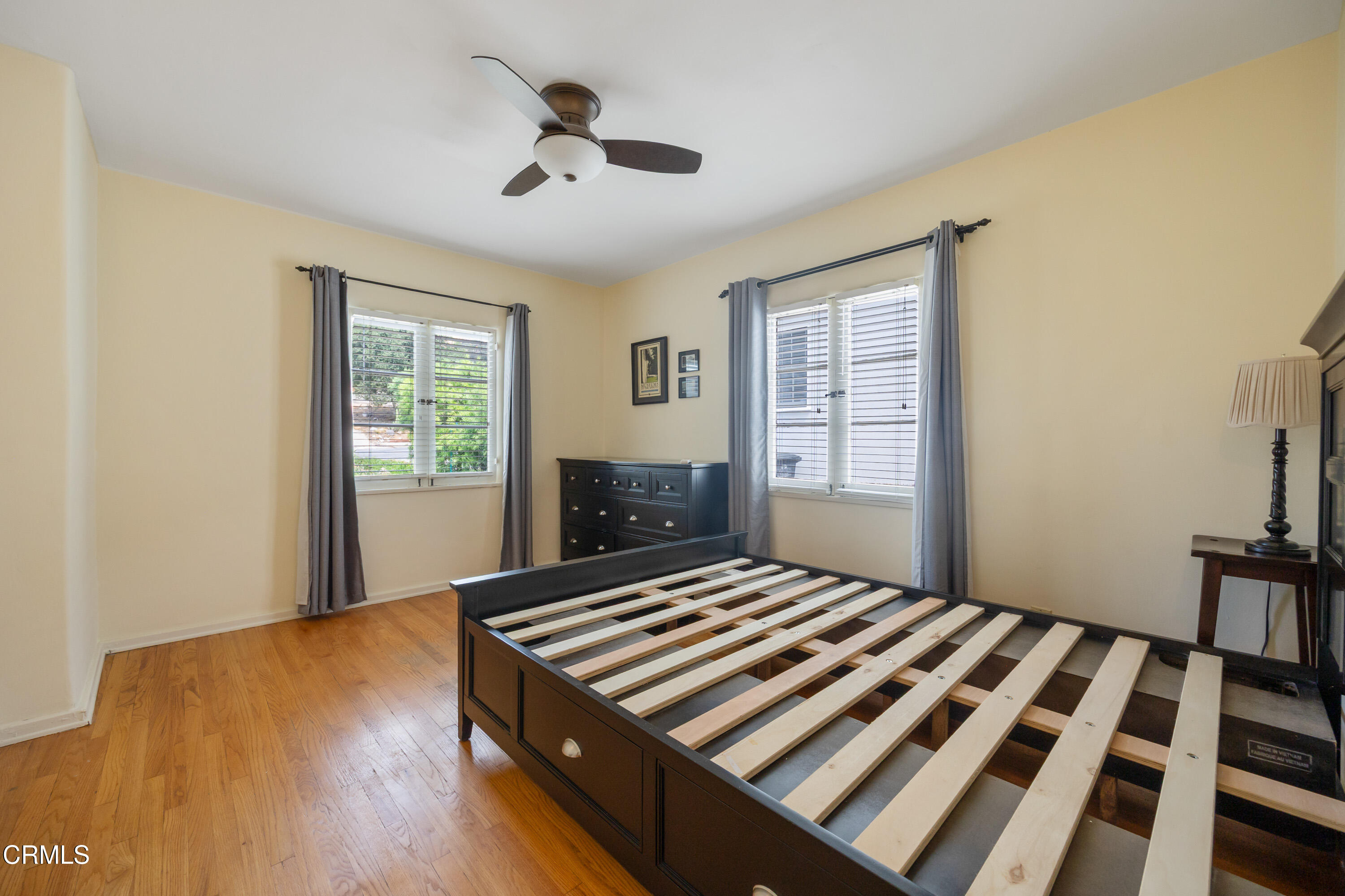 974 Athens Street Altadena, CA 91001 - Photo 19 of 24 a bedroom with a bed and a window