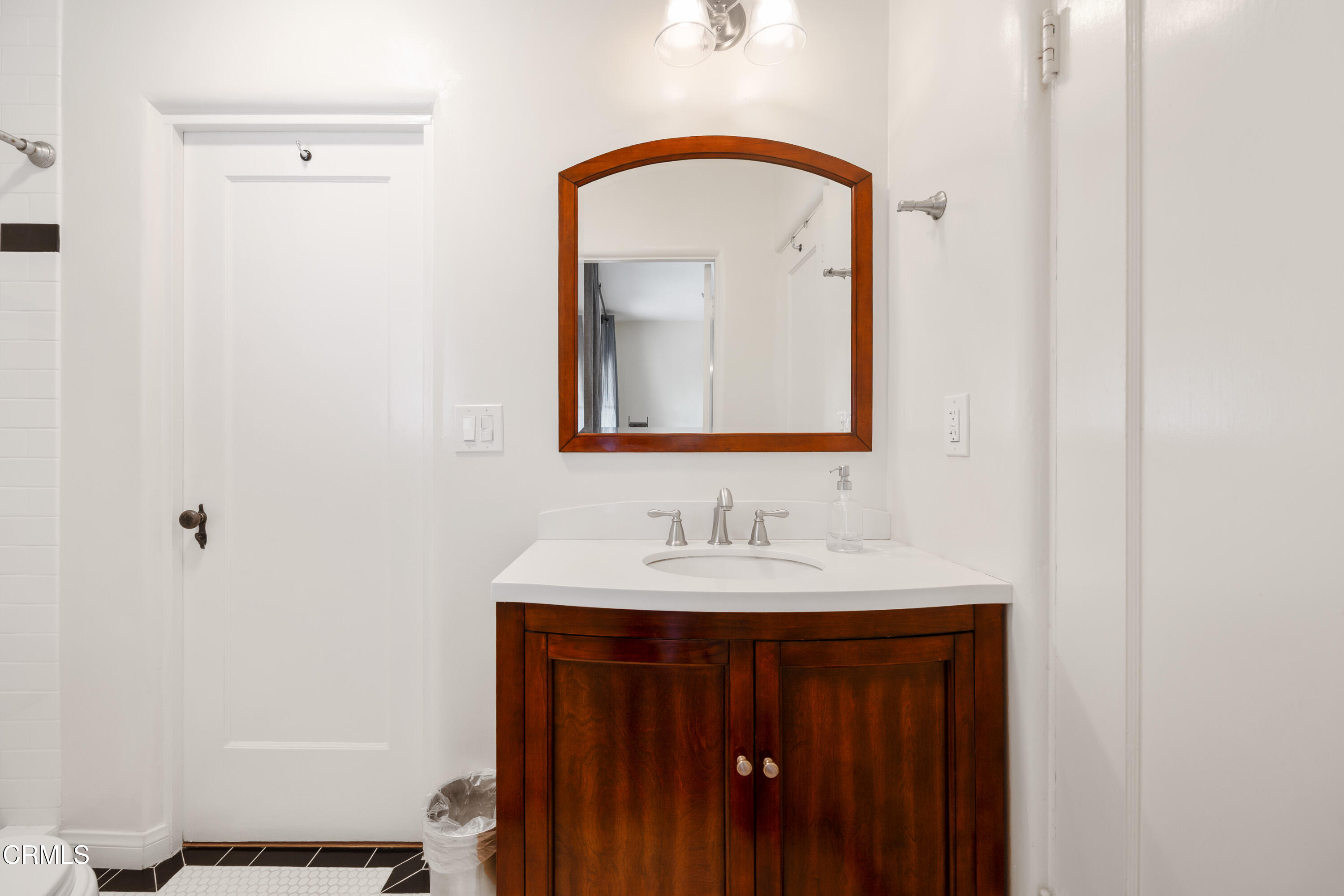 974 Athens Street Altadena, CA 91001 - Photo 20 of 24 a bathroom with a sink and a mirror