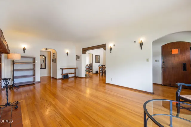 a view of a living room kitchen with furniture and a table