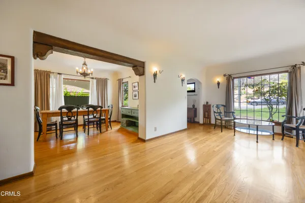 a view of a livingroom with furniture and a large window
