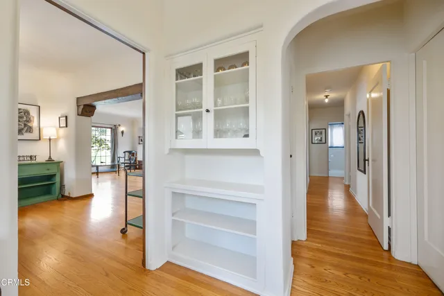 a view of a hallway view with wooden floor and staircase