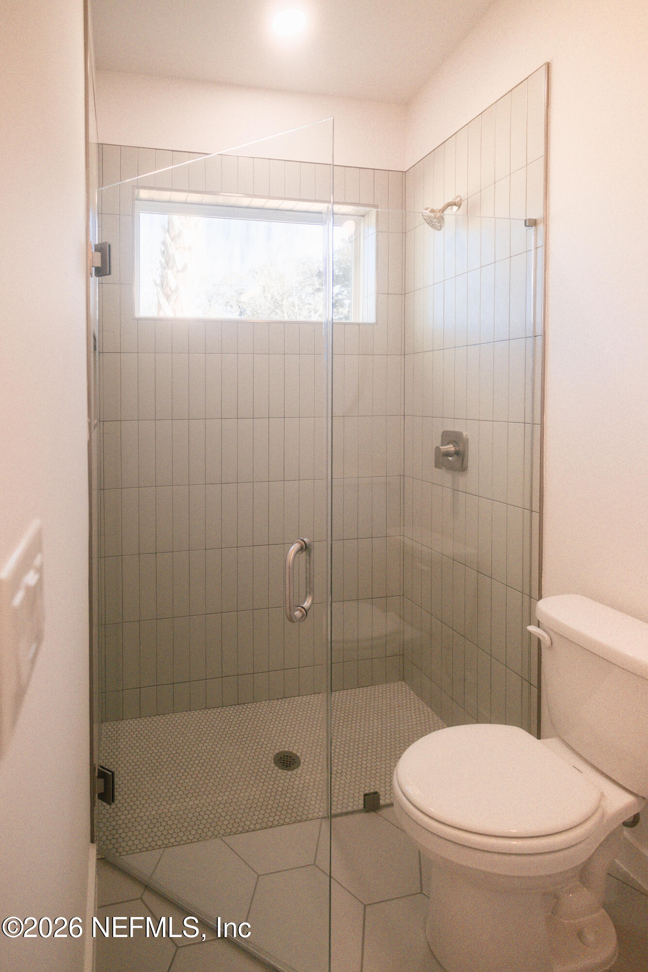 572 Woodlawn Road St. Augustine, FL 32084 - Photo 10 of 15 a bathroom with a toilet and a shower
