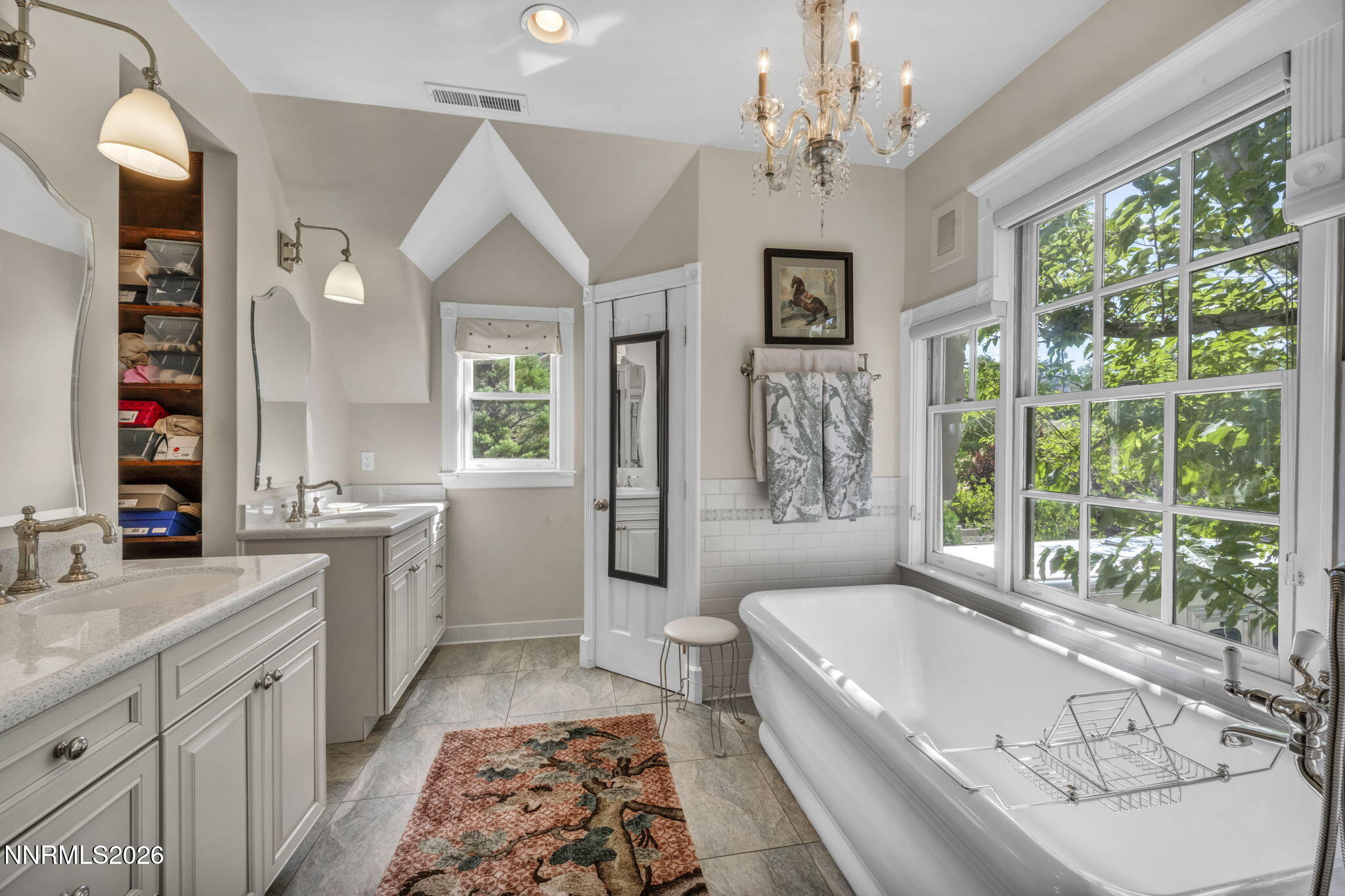 4010 Canyon Drive Reno, NV 89519 - Photo 9 of 147 a spacious bathroom with a granite countertop tub a double vanity sink a window and a mirror