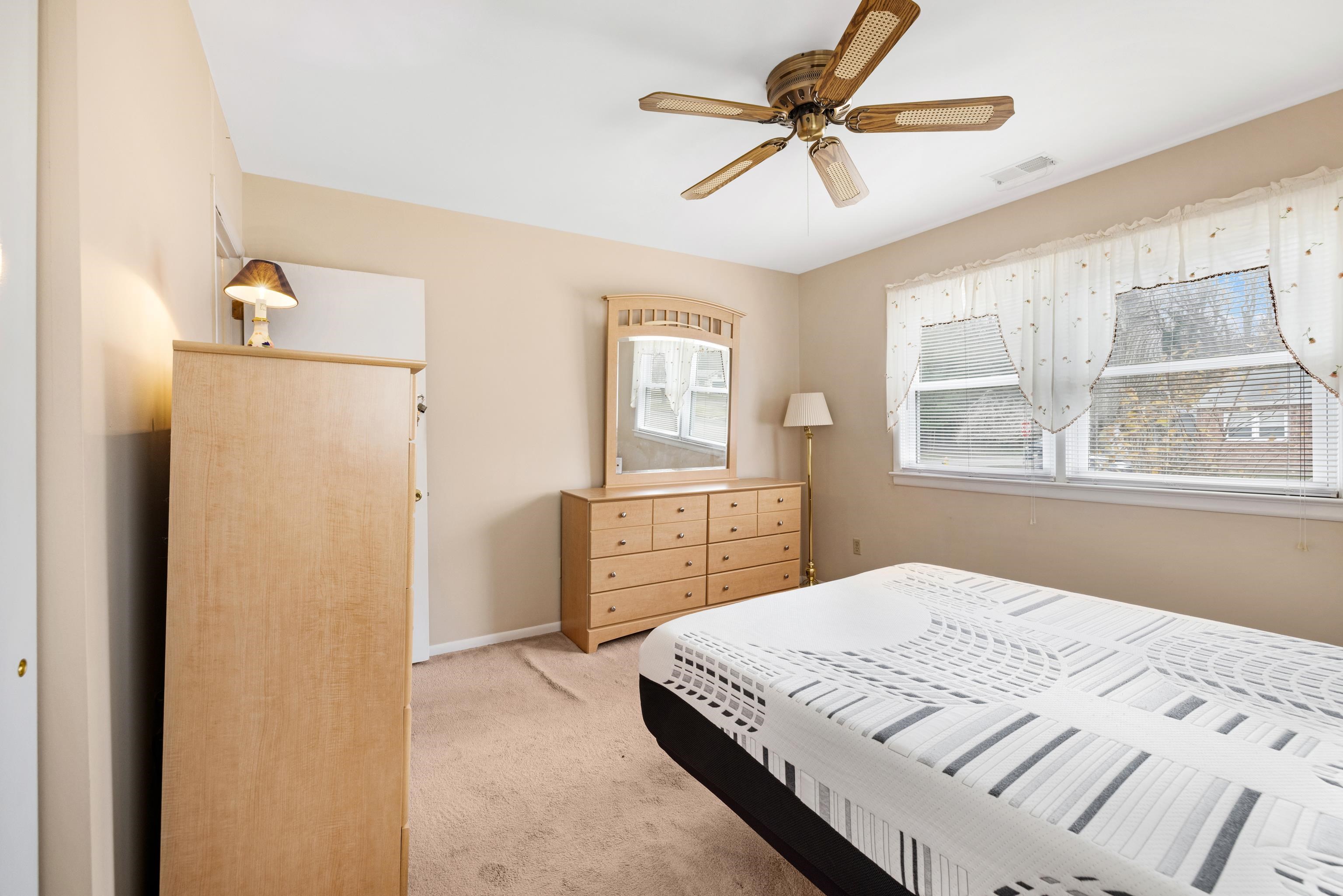 315 East Drumbed Road Villas, NJ 08251 - Photo 12 of 32 a bedroom with a bed dresser and a window