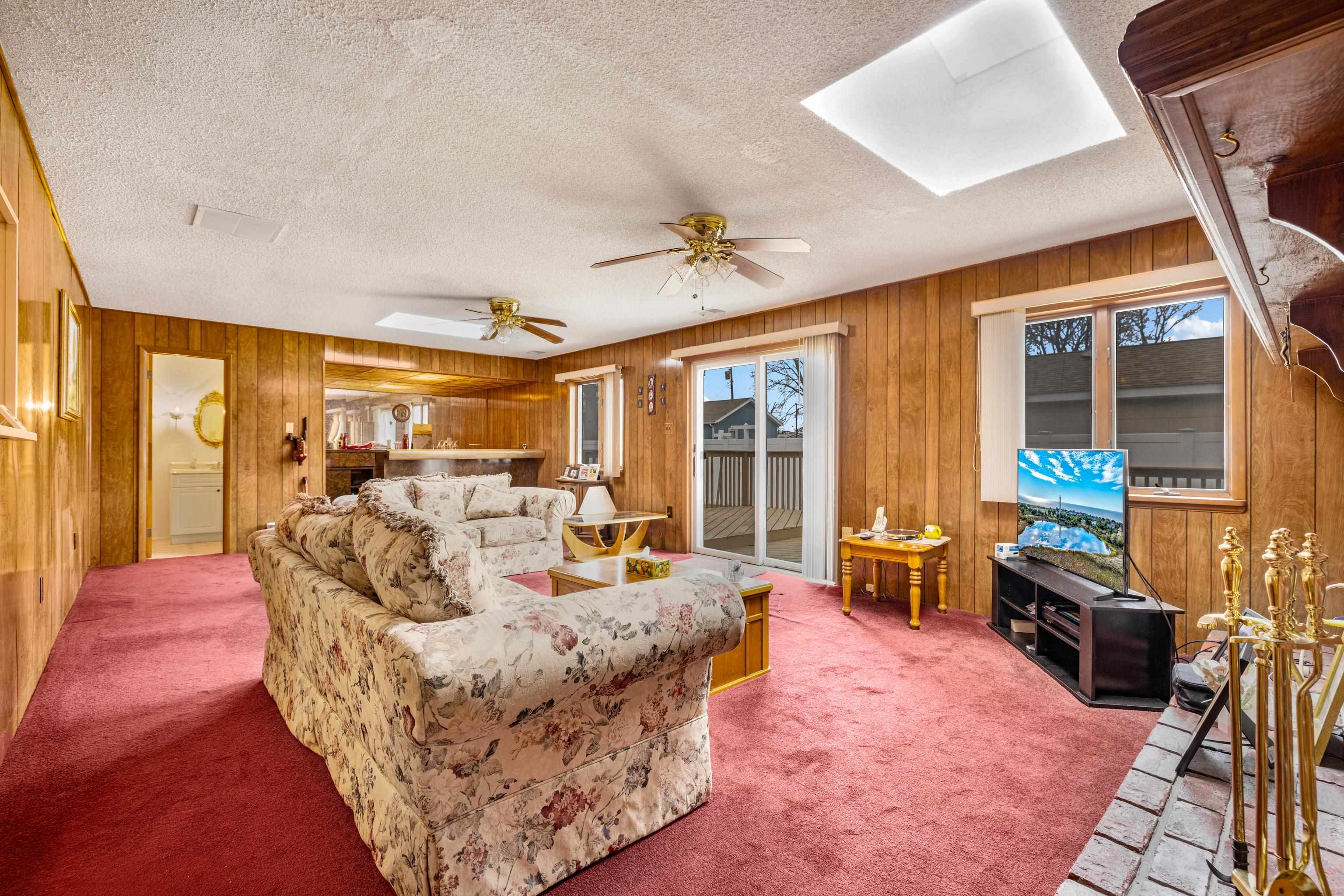 315 East Drumbed Road Villas, NJ 08251 - Photo 23 of 32 a living room with furniture fireplace and large windows