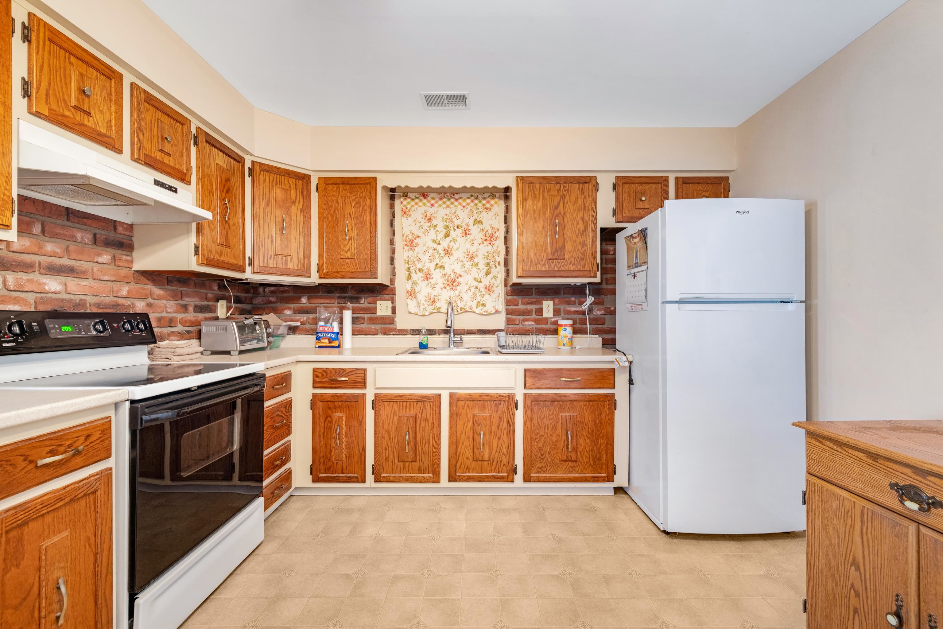 315 East Drumbed Road Villas, NJ 08251 - Photo 8 of 32 a kitchen with stainless steel appliances granite countertop a refrigerator a stove a sink and white cabinets