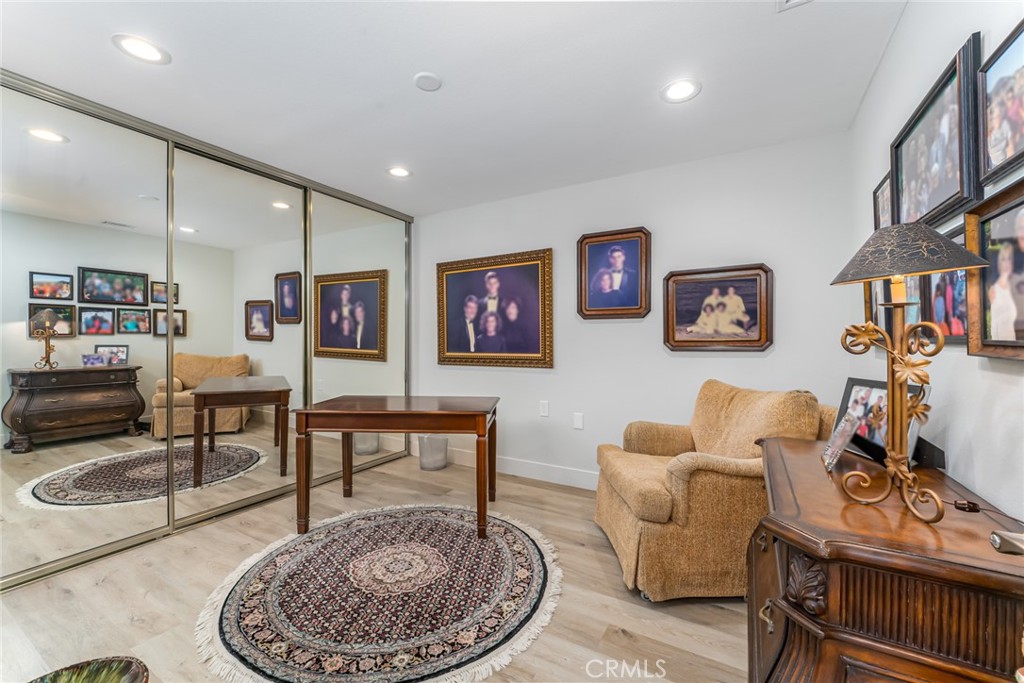 74 Calle Aragon, Unit B Laguna Woods, CA 92637 - Photo 17 of 22 a living room with furniture and a table