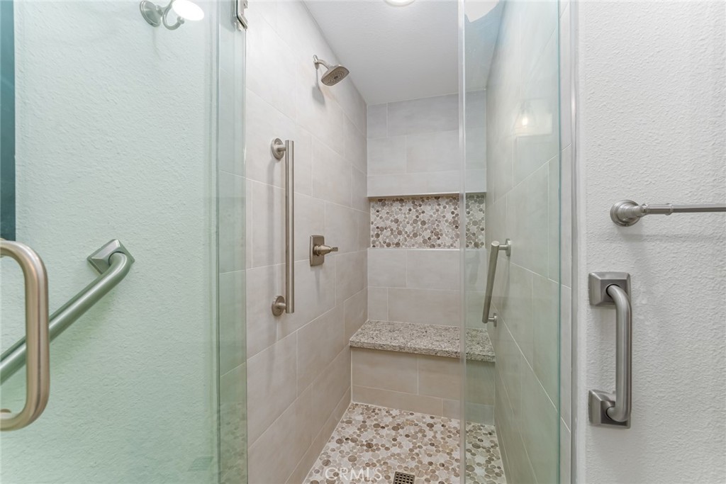 74 Calle Aragon, Unit B Laguna Woods, CA 92637 - Photo 19 of 22 a bathroom with a shower