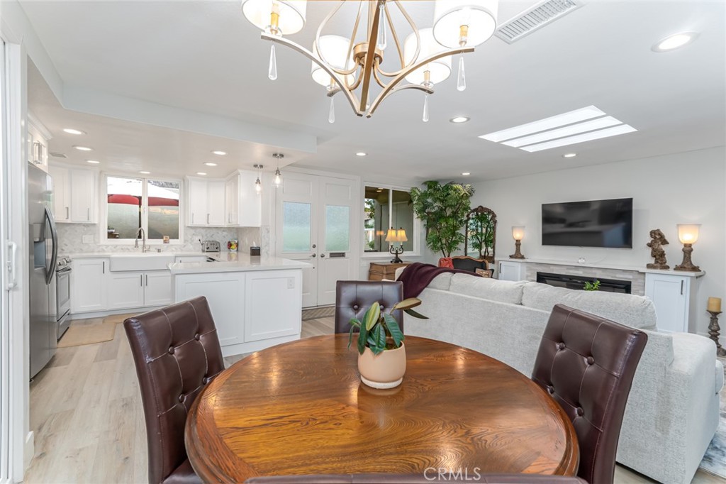 74 Calle Aragon, Unit B Laguna Woods, CA 92637 - Photo 7 of 22 a view of a dining room with furniture