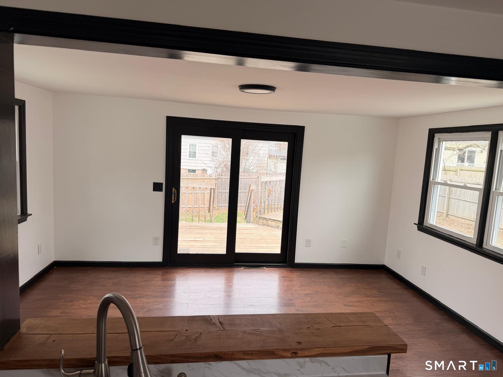 44 Lynmoor Place Hamden, CT 06517 - Photo 12 of 30 a view of a room with wooden floor and windows