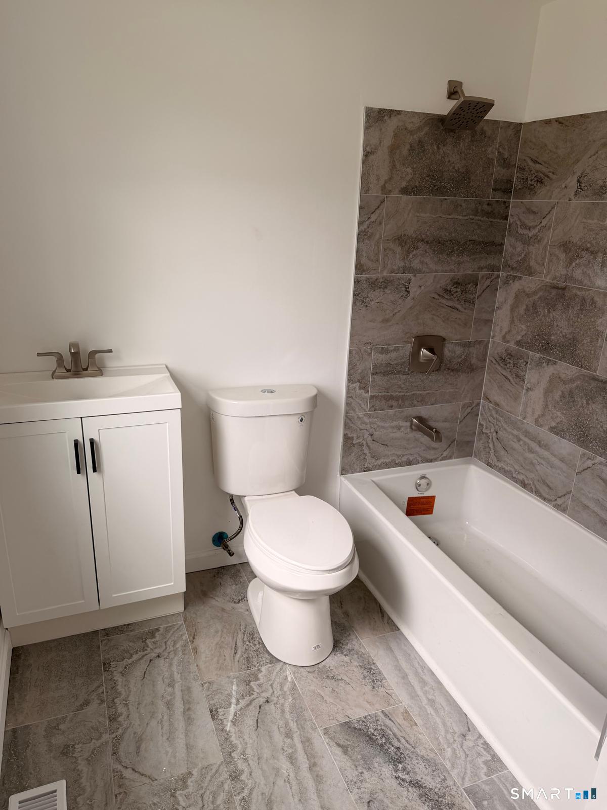 44 Lynmoor Place Hamden, CT 06517 - Photo 18 of 30 a bathroom with a toilet a sink and bathtub