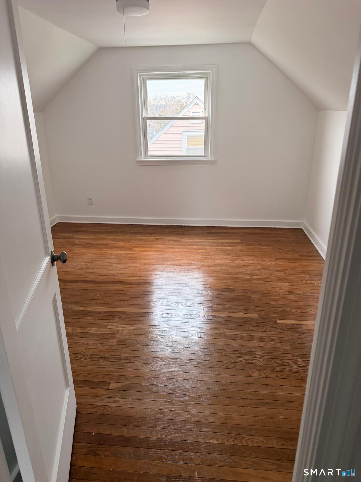 44 Lynmoor Place Hamden, CT 06517 - Photo 27 of 30 a view of a room with wooden floor