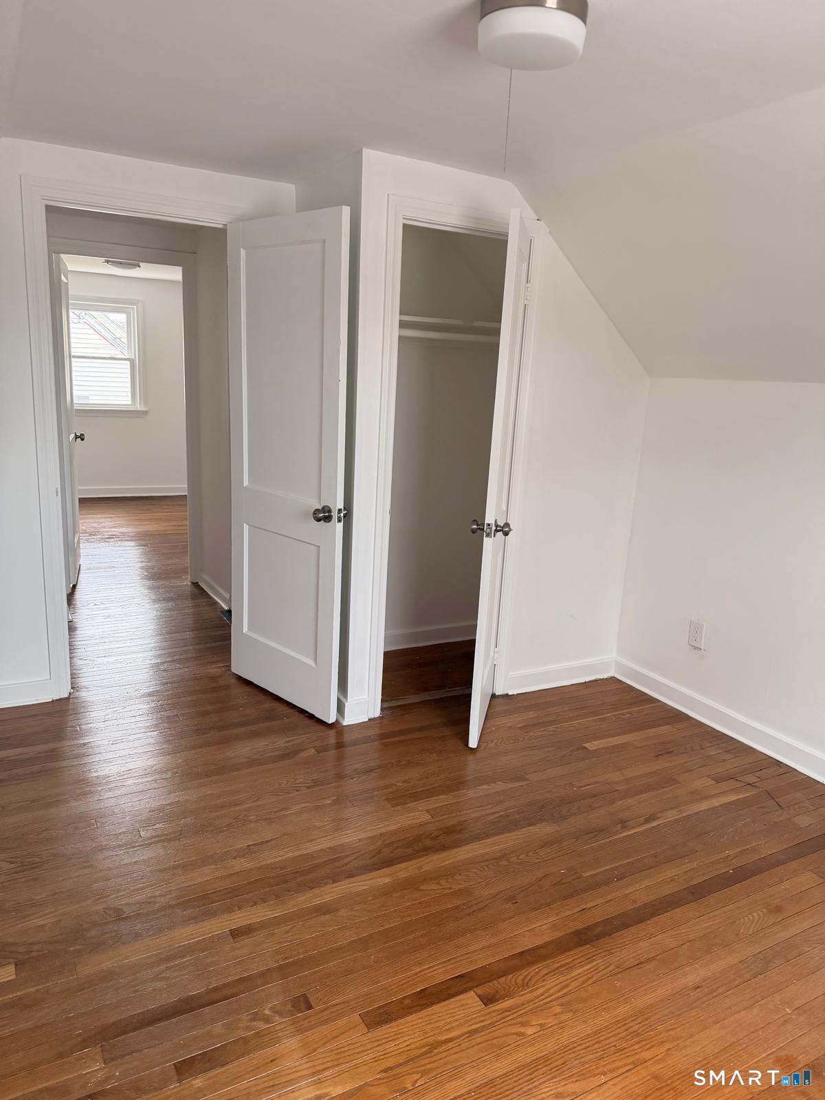 44 Lynmoor Place Hamden, CT 06517 - Photo 28 of 30 an empty room with wooden floor & windows