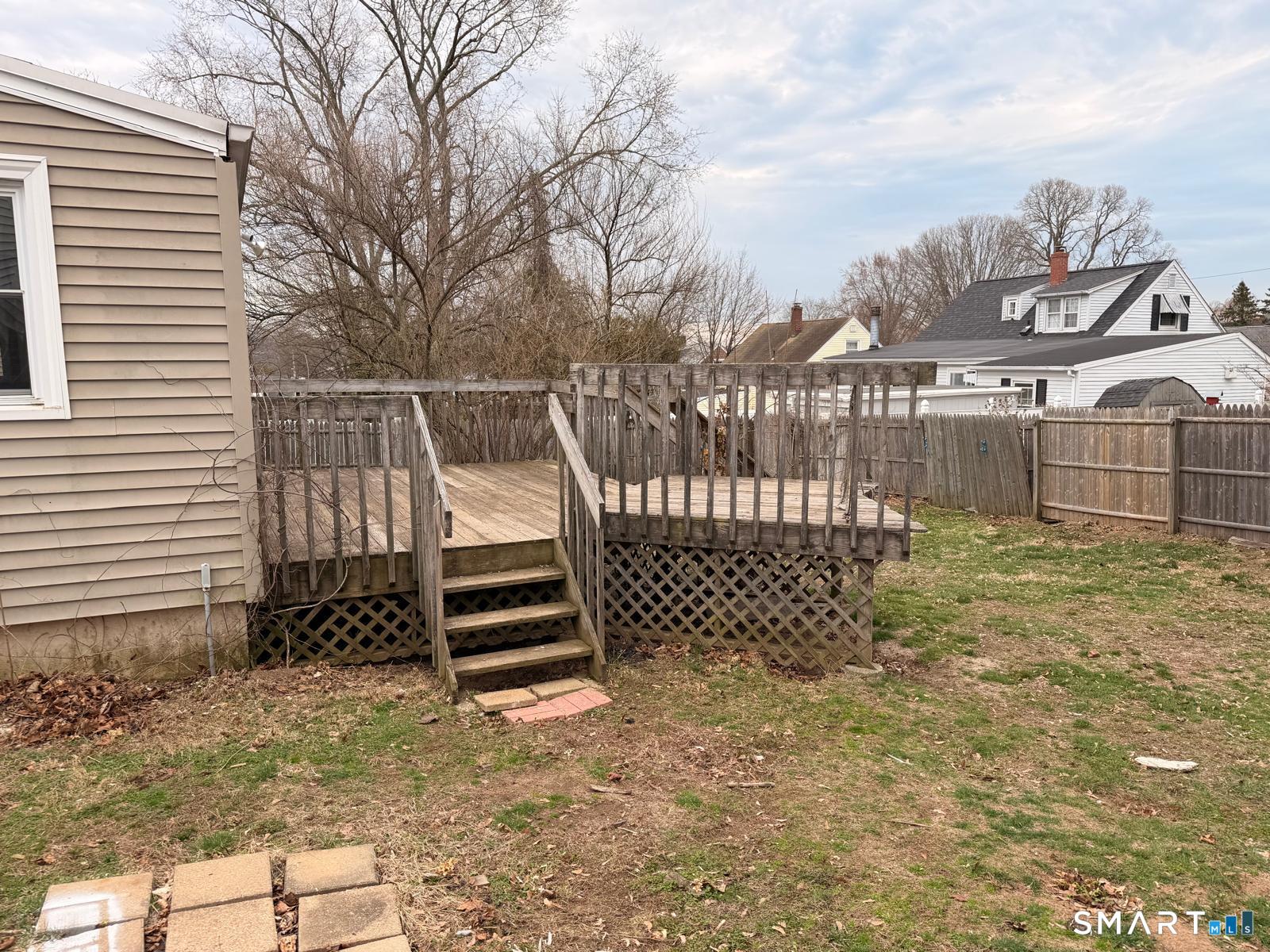 44 Lynmoor Place Hamden, CT 06517 - Photo 6 of 30 a view of a house with a wooden fence
