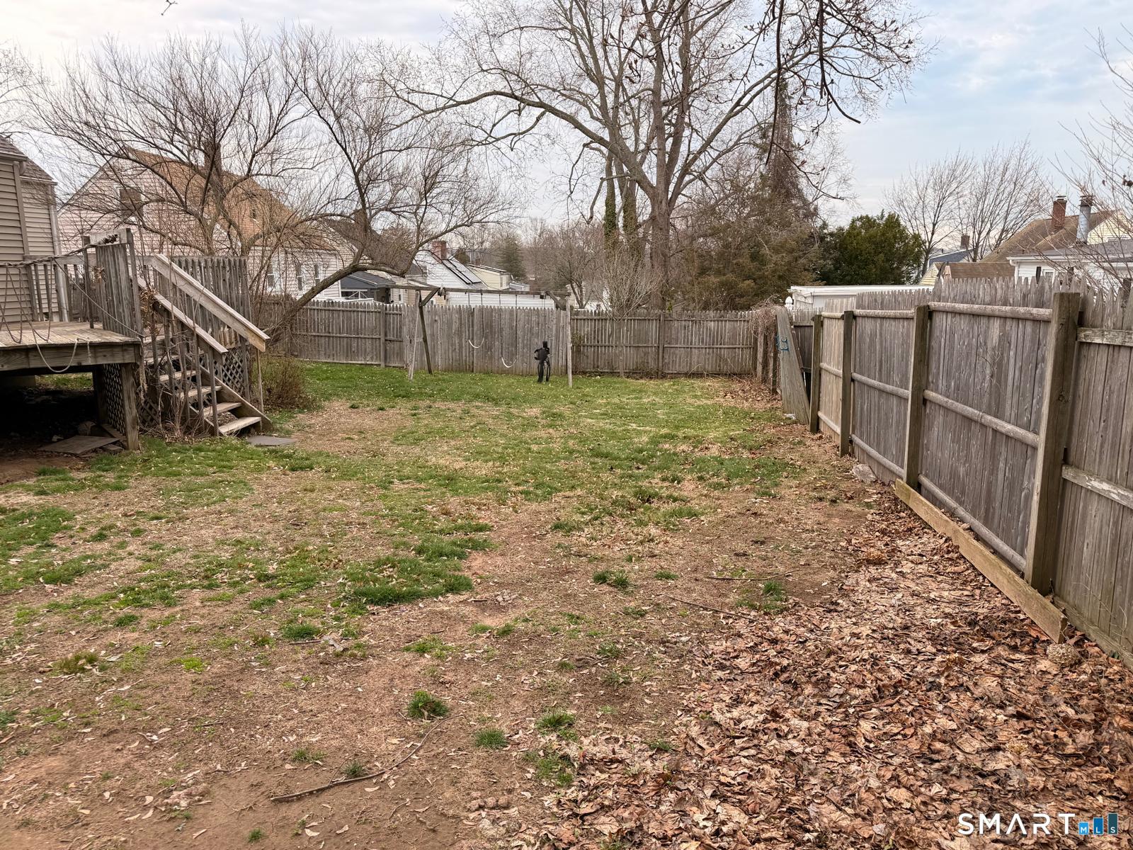 44 Lynmoor Place Hamden, CT 06517 - Photo 8 of 30 a view of a backyard with wooden fence