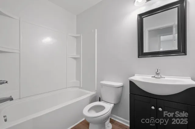 a bathroom with a toilet a sink and a bathtub