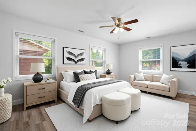 a bedroom with a bed and a couch