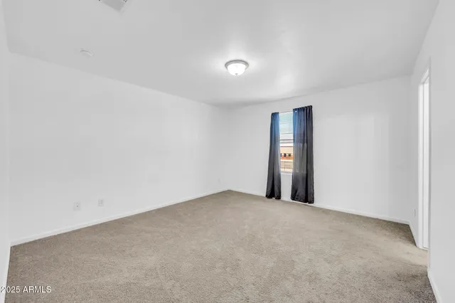 a bathroom with a granite countertop sink a mirror and a bathtub
