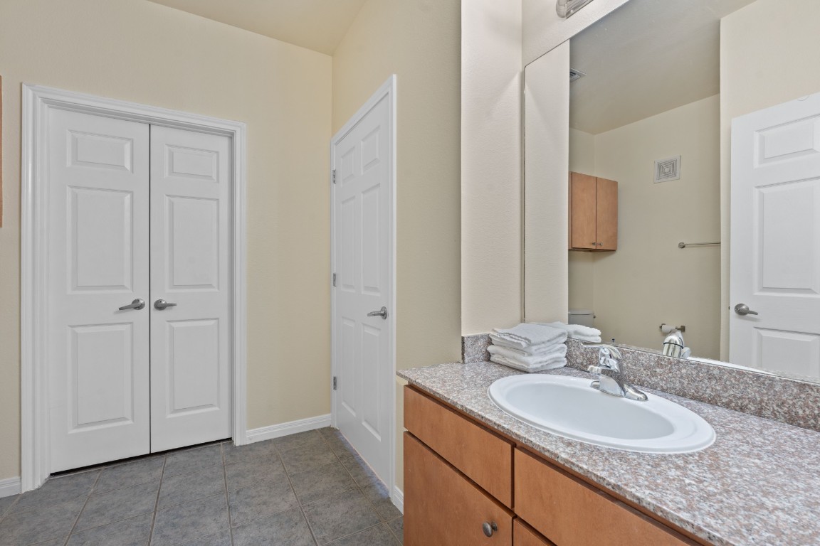 2502 Leon Street, Unit 501 Austin, TX 78705 - Photo 13 of 14 Bathroom featuring vanity and tile patterned flooring