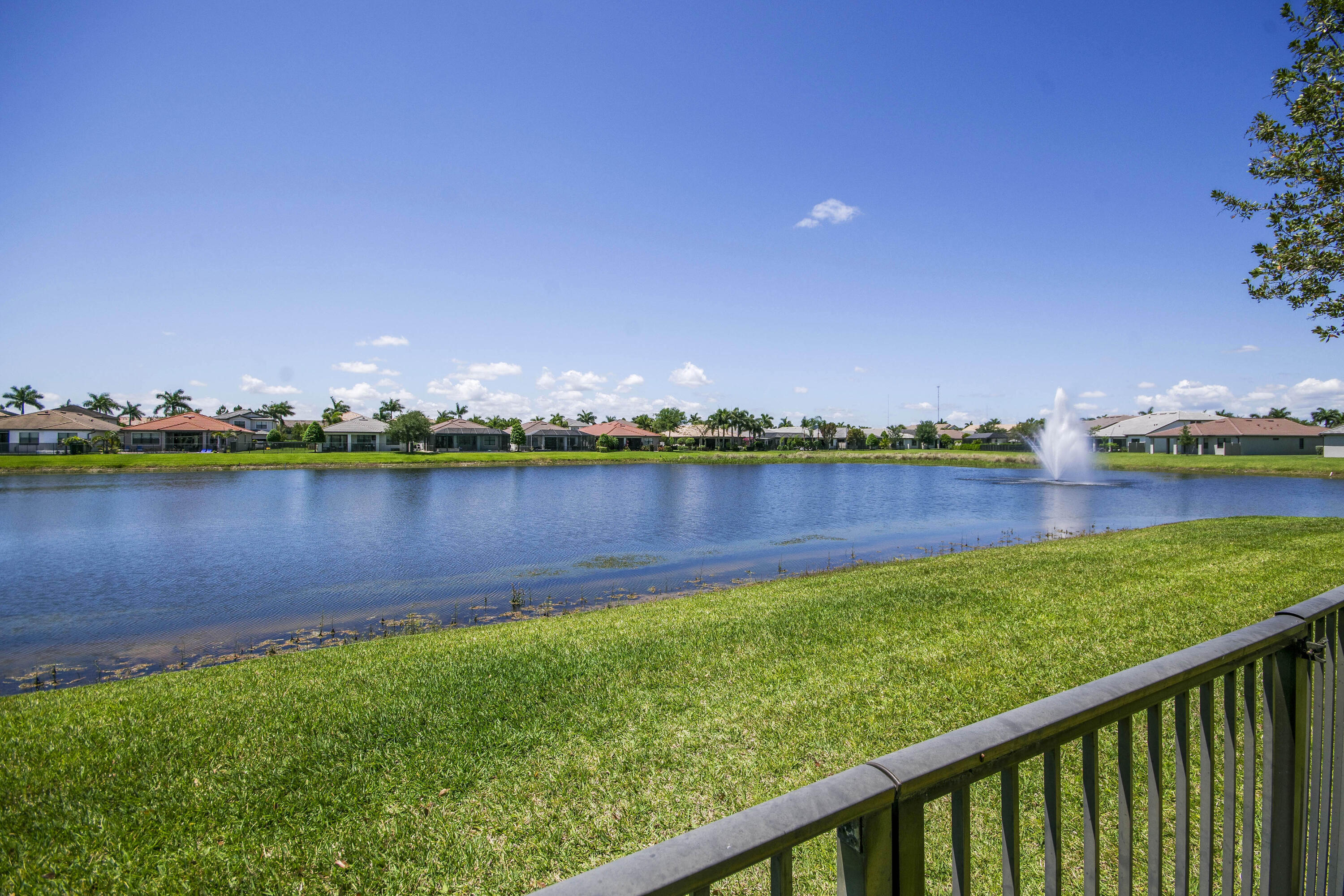 8301 Rearing Lane Lake Worth, FL 33467 - Photo 4 of 33 a view of a lake with houses in the back