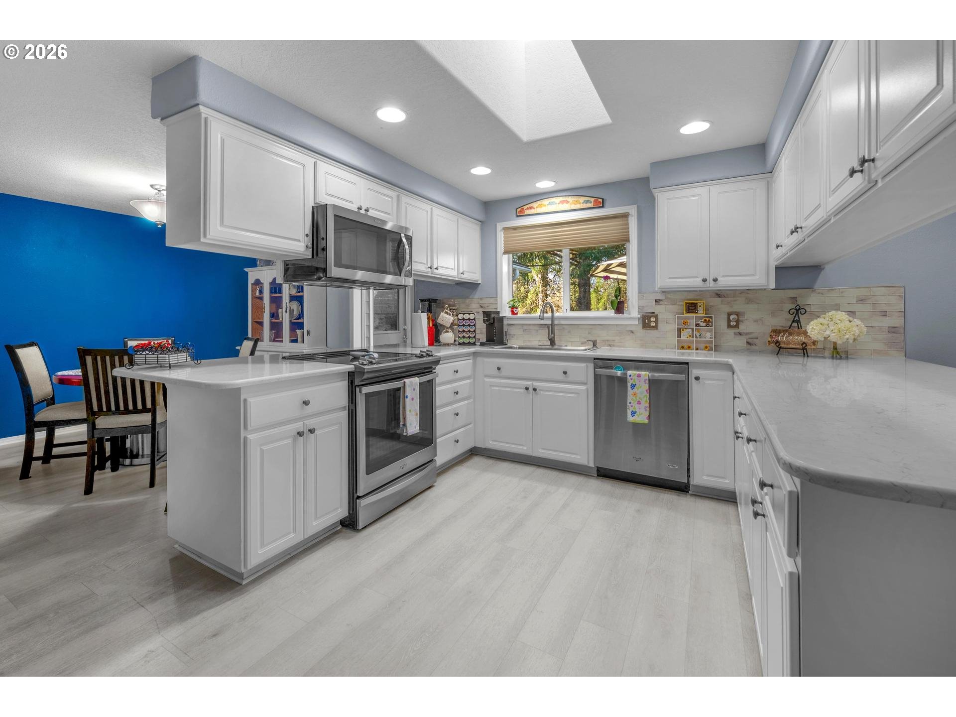 33261 Filbert Lane Warren, OR 97053 - Photo 11 of 35 a kitchen with a sink a window and chairs