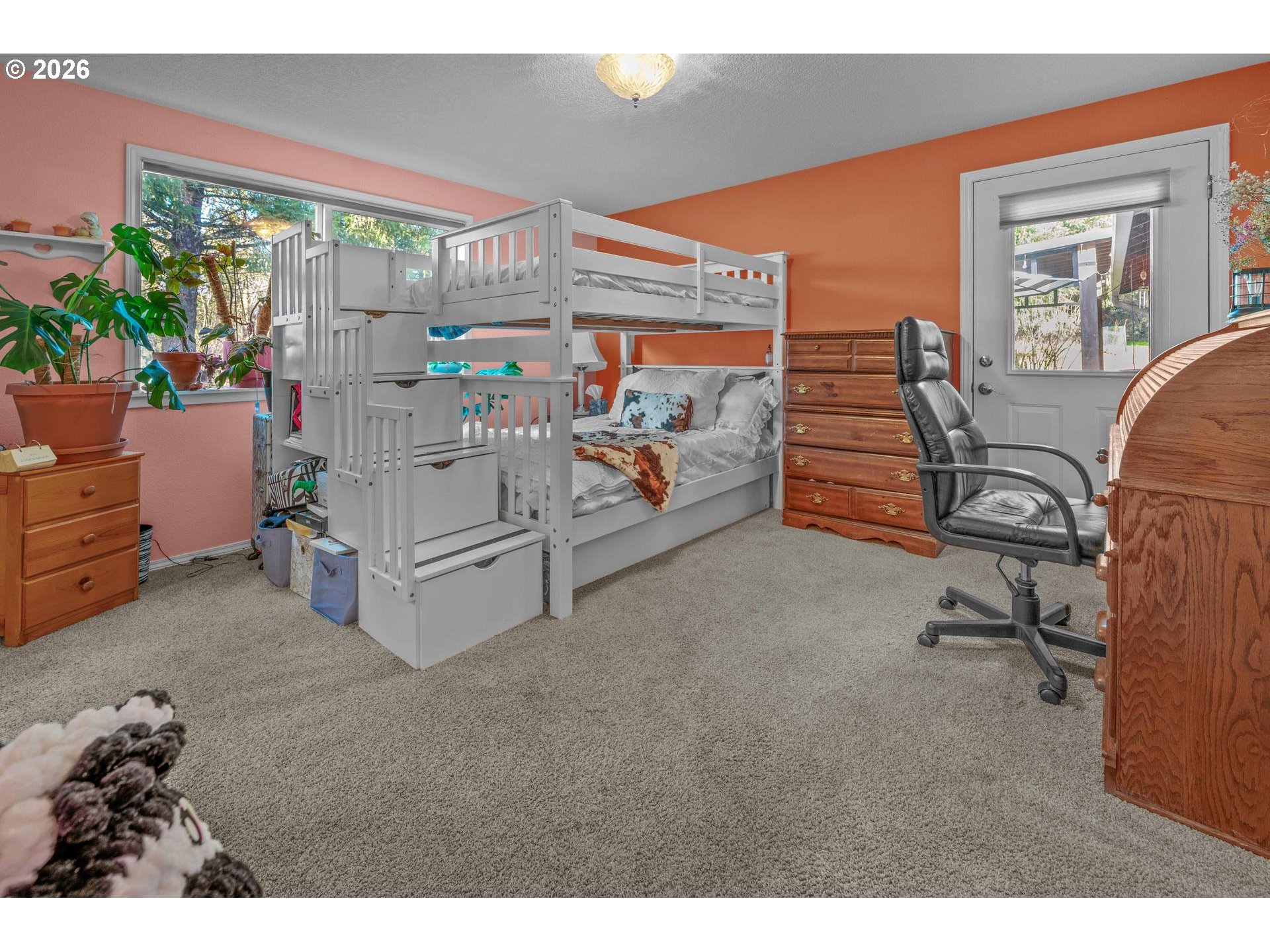 33261 Filbert Lane Warren, OR 97053 - Photo 25 of 35 a bedroom with furniture and a potted plant