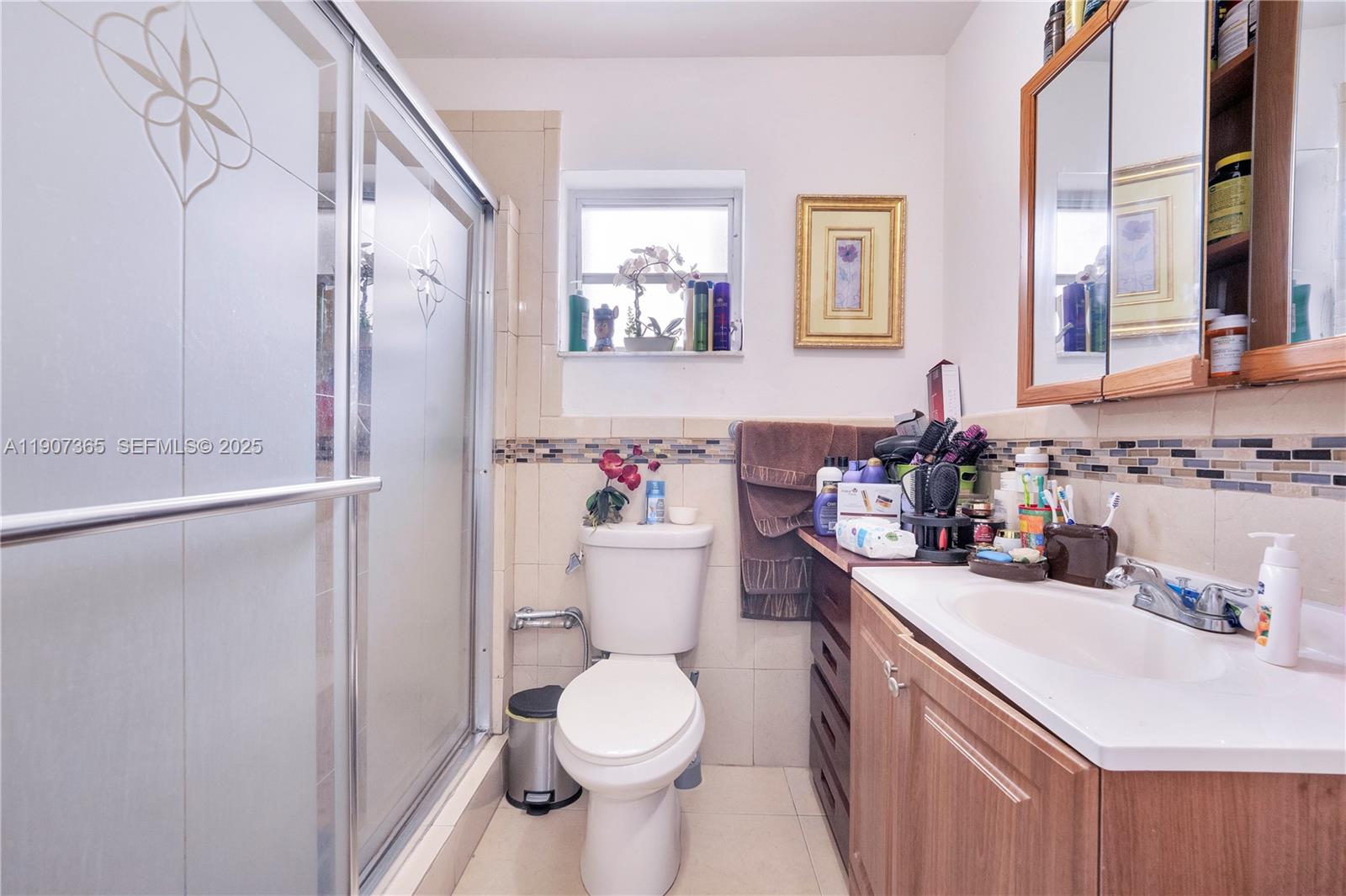 18922 Southwest 120th Court Miami, FL 33177 - Photo 12 of 29 a bathroom with a sink toilet and shower