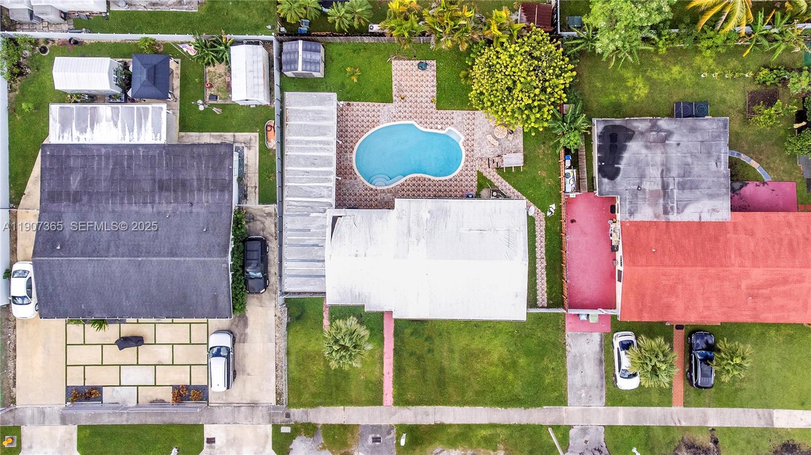 18922 Southwest 120th Court Miami, FL 33177 - Photo 28 of 29 an aerial view of residential houses with outdoor space and trees