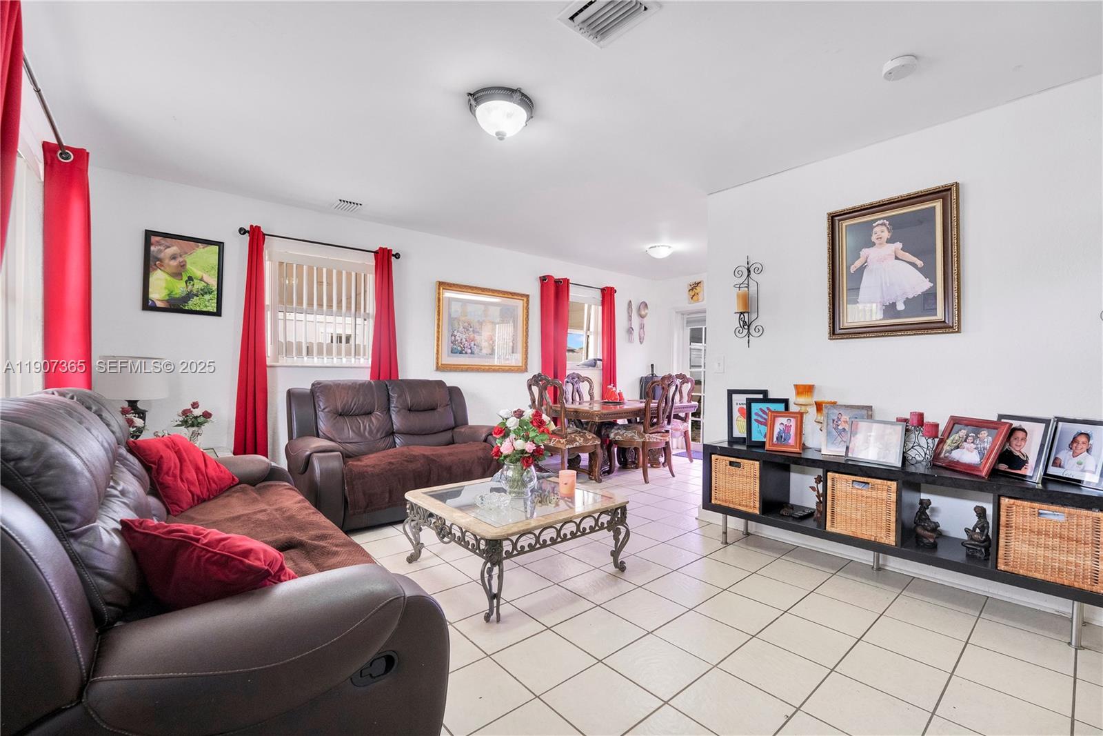 18922 Southwest 120th Court Miami, FL 33177 - Photo 3 of 29 a living room with furniture and a flat screen tv